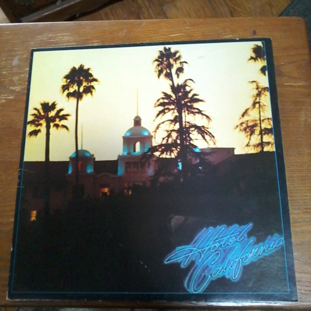 Eagles Hotel California vinyl record 6E-103 Asylum from 1976. Includes poster.
